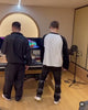 Diss gacha in a recording studio, one wearing black tracksuit and the other in a black and white longsleeve shirt.